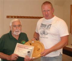 The monthly winner Norman Smithers received his certificate from Tony Handford
